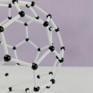 Photo by Tara Winstead Close-up of a geometric molecular structure model against a pastel background.